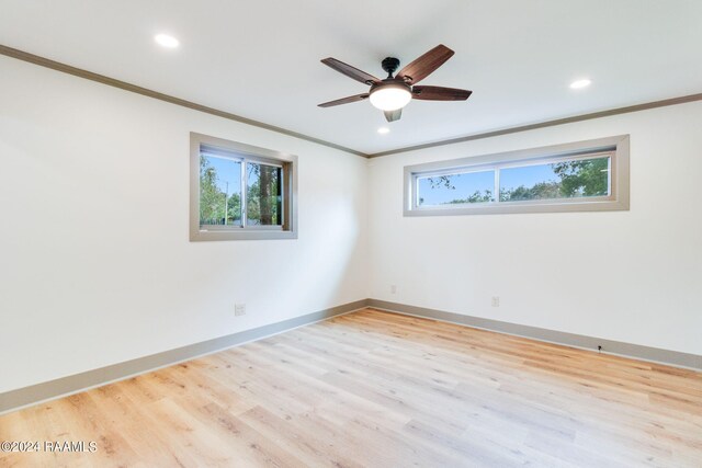 unfurnished room featuring light hardwood / wood-style flooring, ceiling fan, and crown molding