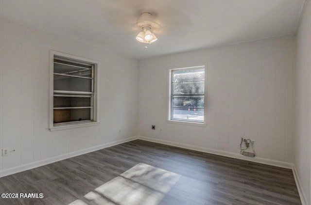 empty room featuring dark hardwood / wood-style flooring