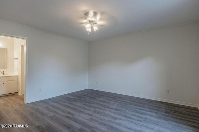 interior space featuring ceiling fan, ornamental molding, and hardwood / wood-style flooring