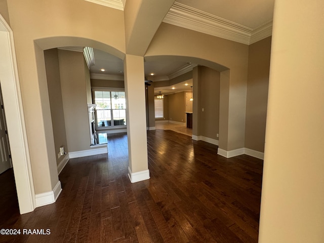 hall featuring ornamental molding and dark hardwood / wood-style floors