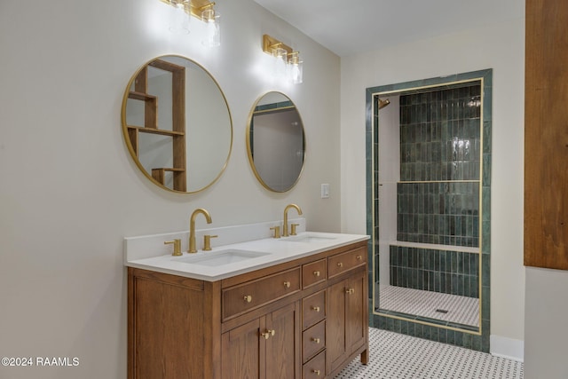 bathroom featuring tiled shower and vanity