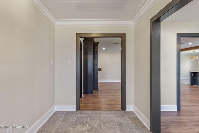 hallway featuring ornamental molding