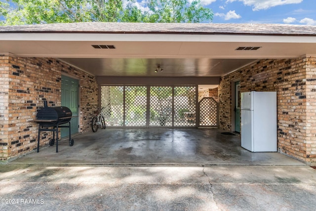 192 Tillou Andrus Dr, Opelousas, LA 70570 - view of patio / terrace featuring a carport, area for grilling, and visible vents