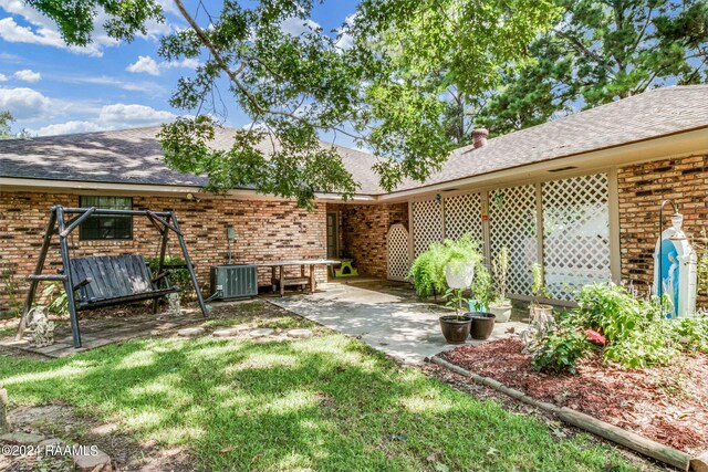 192 Tillou Andrus Dr, Opelousas, LA 70570 - view of yard featuring a patio and central AC unit