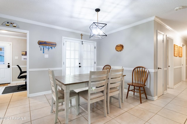 192 Tillou Andrus Dr, Opelousas, LA 70570 - dining space with light tile patterned flooring, an inviting chandelier, baseboards, and ornamental molding