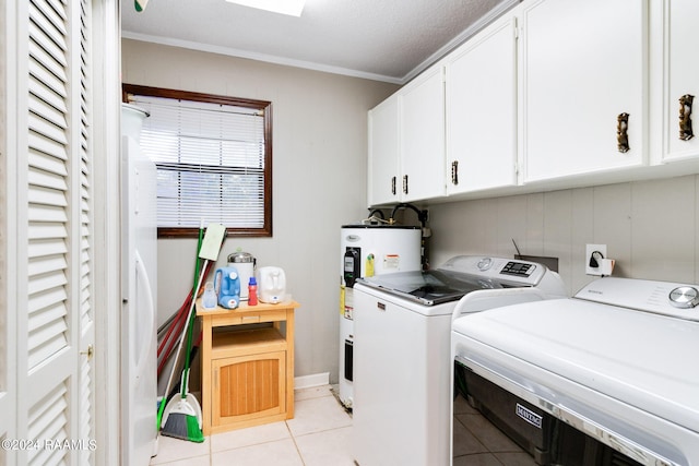 192 Tillou Andrus Dr, Opelousas, LA 70570 - laundry area featuring washing machine and clothes dryer, light tile patterned floors, cabinet space, and electric water heater