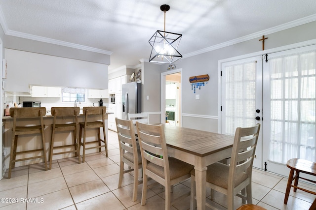 192 Tillou Andrus Dr, Opelousas, LA 70570 - dining room featuring crown molding, a notable chandelier, and light tile patterned floors