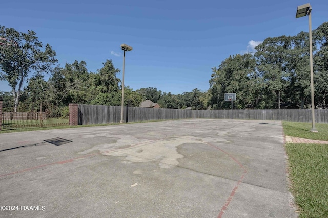 view of patio featuring basketball hoop