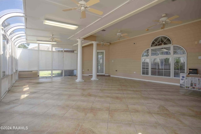 interior space with ceiling fan