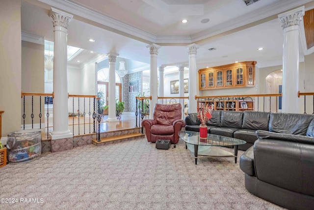 carpeted living room featuring a tray ceiling, decorative columns, and ornamental molding