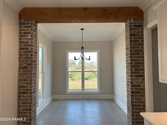 unfurnished dining area featuring crown molding, beamed ceiling, and a notable chandelier