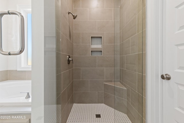 bathroom with a shower stall