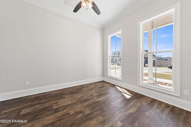 unfurnished room with dark wood finished floors, crown molding, baseboards, and ceiling fan