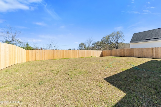 view of yard featuring a fenced backyard