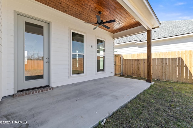 view of patio / terrace featuring ceiling fan and fence