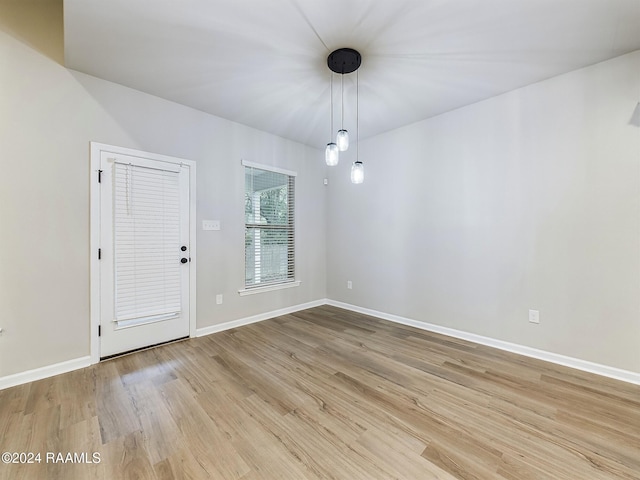 empty room with light hardwood / wood-style floors