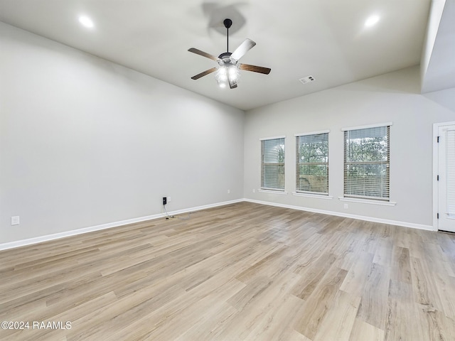 spare room featuring ceiling fan and light hardwood / wood-style flooring