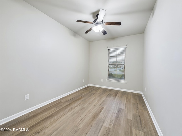 spare room with light hardwood / wood-style floors and ceiling fan