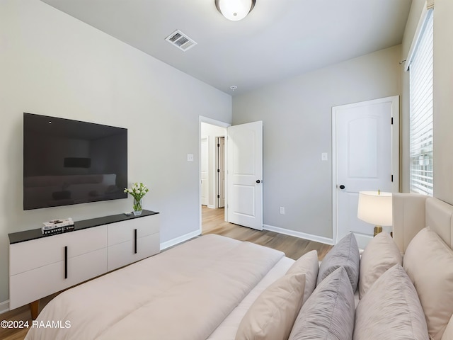 bedroom with light wood-type flooring