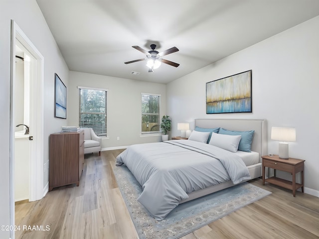 bedroom featuring ceiling fan and light hardwood / wood-style flooring