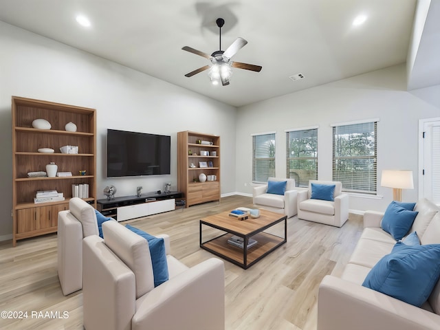 living room with ceiling fan and light wood-type flooring