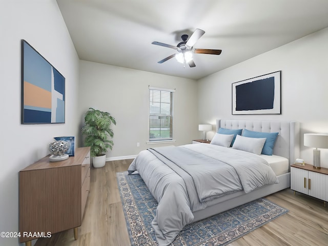 bedroom featuring light wood-type flooring and ceiling fan