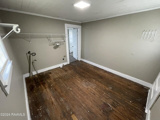 washroom with ornamental molding and dark hardwood / wood-style floors