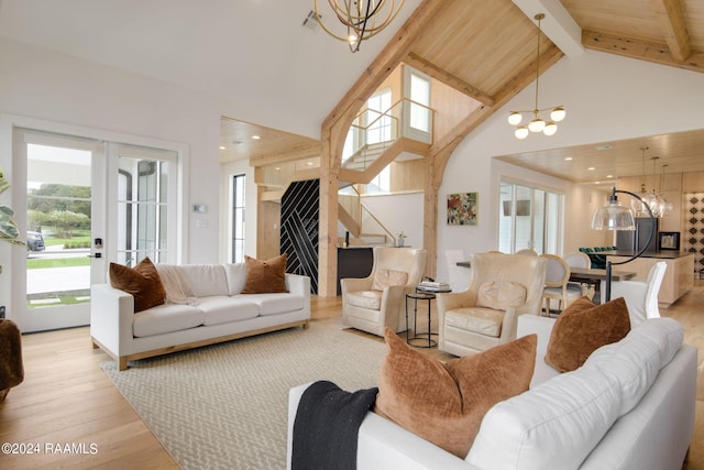 living room with an inviting chandelier, light wood-type flooring, wood ceiling, high vaulted ceiling, and beam ceiling