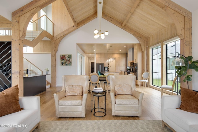 living room with wooden ceiling, light wood-type flooring, a chandelier, high vaulted ceiling, and beam ceiling