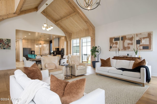 living room with light wood-type flooring, high vaulted ceiling, an inviting chandelier, and beam ceiling