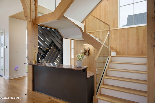 stairs featuring wood-type flooring