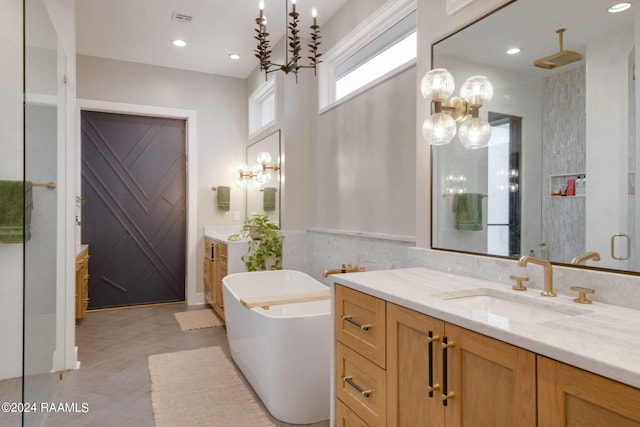 bathroom featuring vanity and separate shower and tub