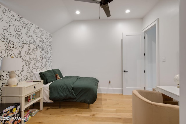 interior space featuring vaulted ceiling, wood-type flooring, and ceiling fan