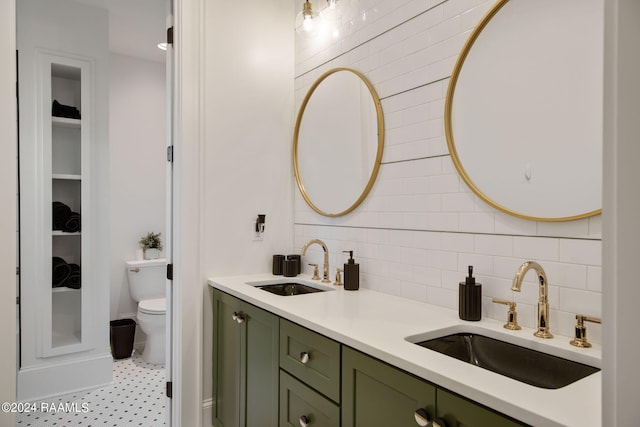 bathroom featuring vanity, toilet, and tile walls