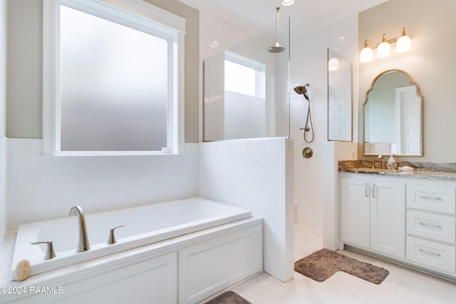 bathroom with plus walk in shower, tile walls, crown molding, and vanity