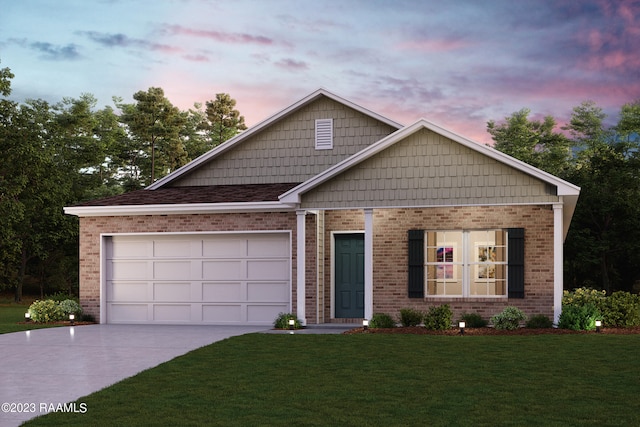 view of front of property featuring a yard and a garage