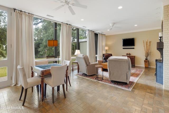 dining room with ceiling fan and ornamental molding