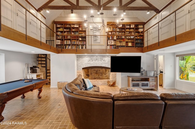 living room with beam ceiling, billiards, a fireplace, and high vaulted ceiling