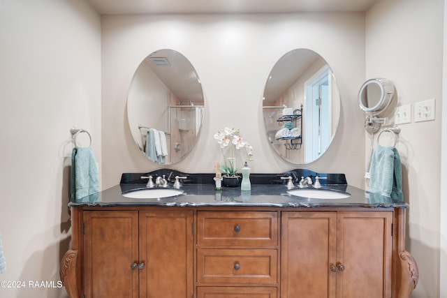 bathroom with vanity and walk in shower