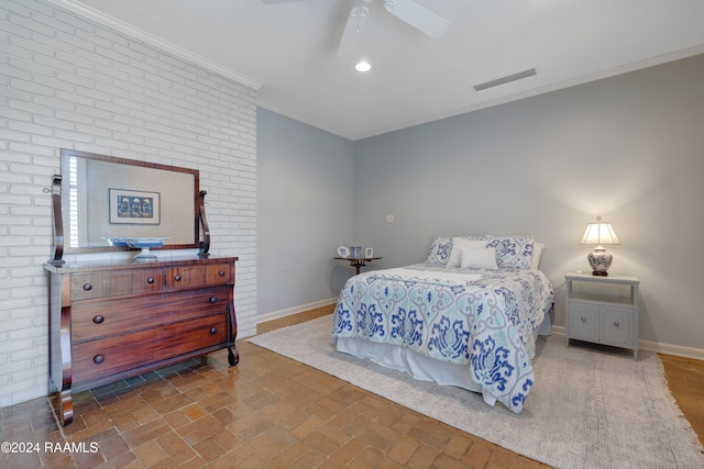 bedroom with ornamental molding and ceiling fan