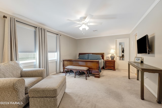 carpeted bedroom with ornamental molding and ceiling fan