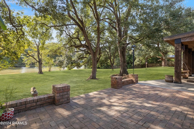 view of patio with a water view