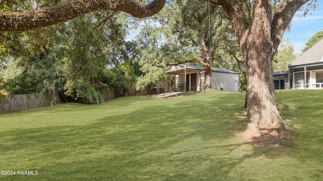 view of yard featuring a sunroom