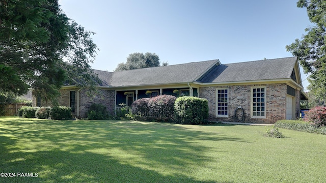 ranch-style house with a front lawn