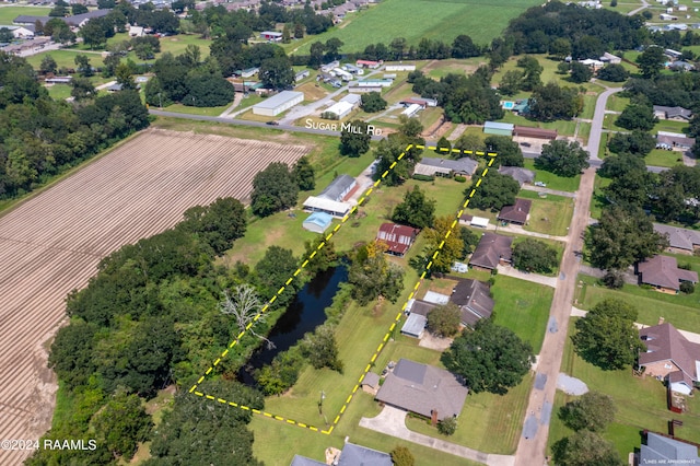 bird's eye view featuring a rural view and a water view