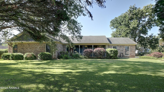 single story home featuring a front yard