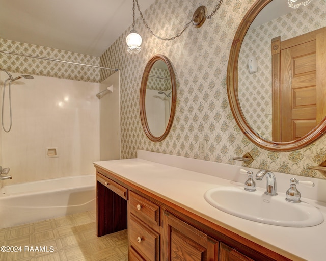 bathroom featuring shower / bathtub combination and vanity