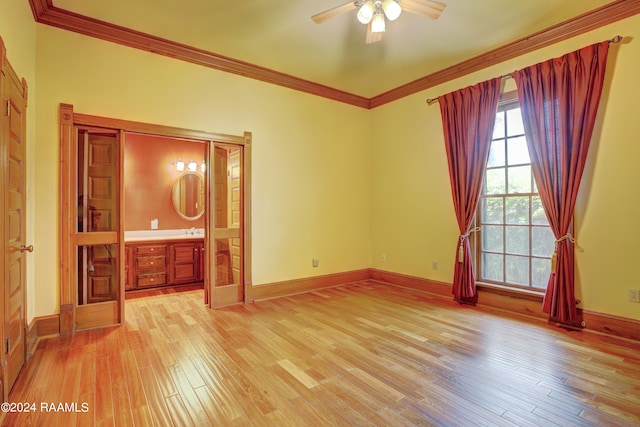 interior space with ceiling fan, ornamental molding, connected bathroom, and light hardwood / wood-style floors