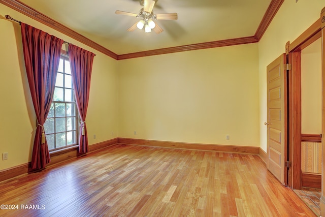 spare room featuring ceiling fan, ornamental molding, and light hardwood / wood-style floors