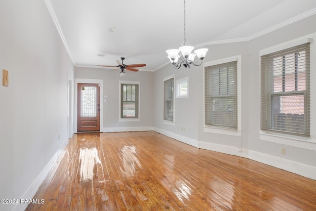 interior space with crown molding, hardwood / wood-style floors, and ceiling fan with notable chandelier